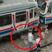 RAYLARA OTURDU TREN ÜZERİNDEN GEÇTİ